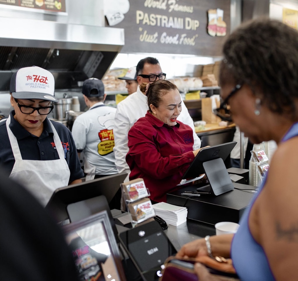 A restaurant team serving customers